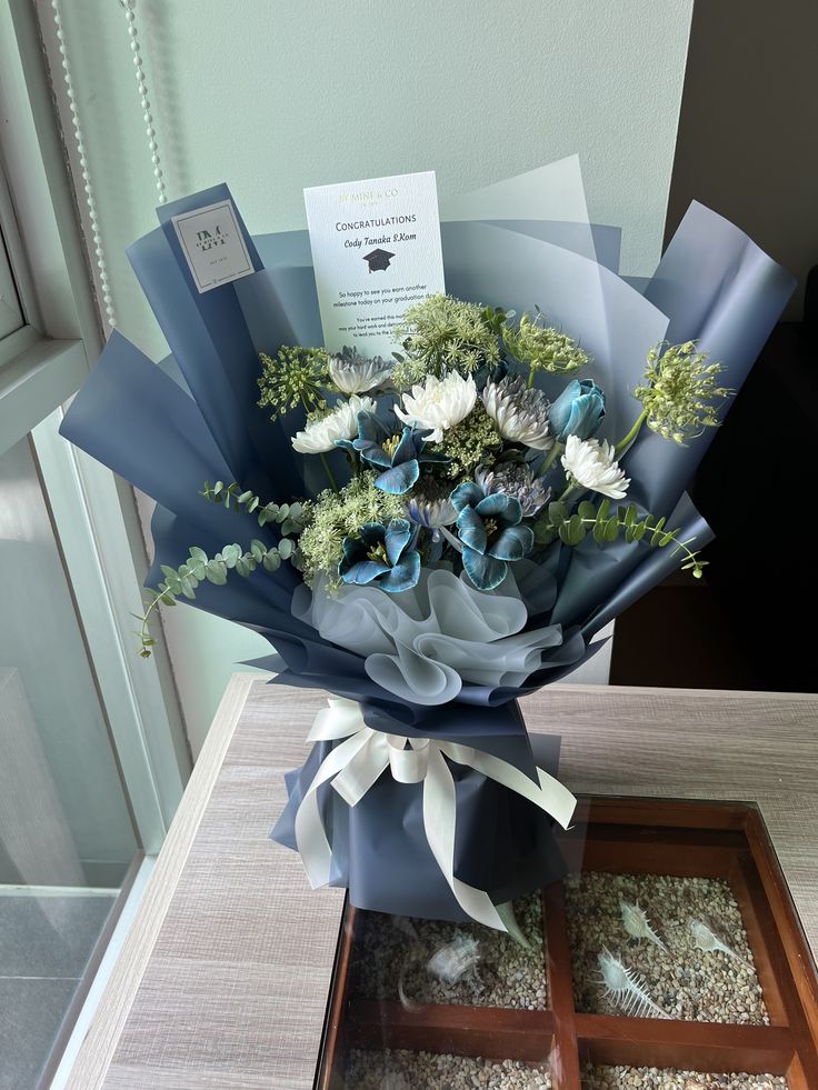 a bouquet of flowers sitting on top of a table