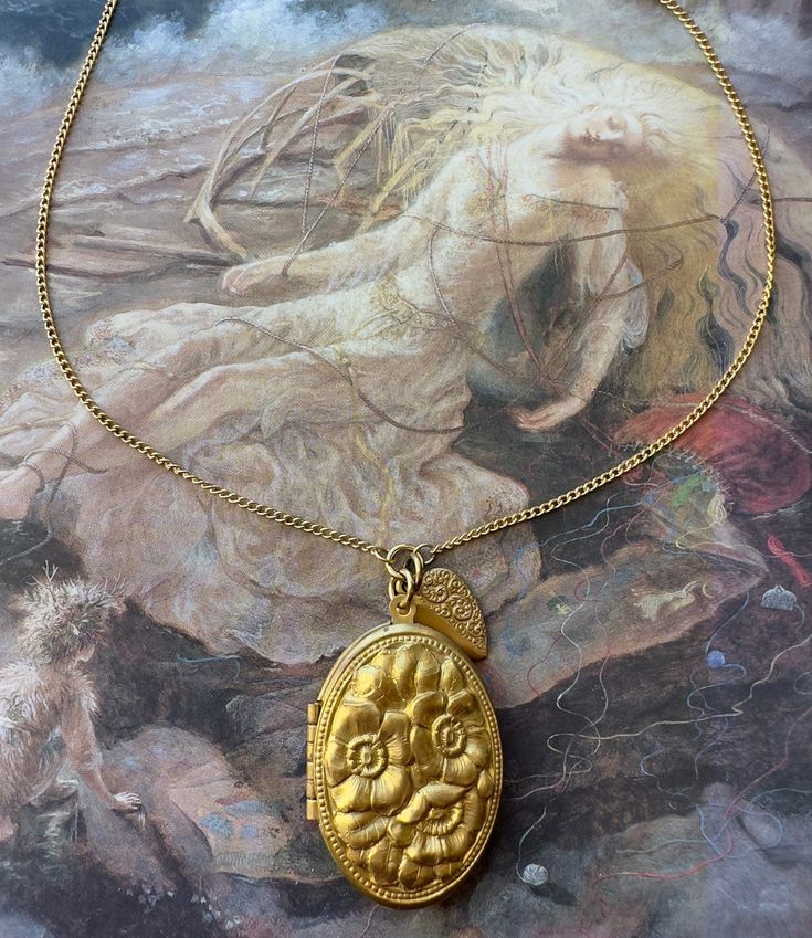 "What a stunning solid brass awesome detailed bold raised relief Floral Locket with Heart Charm. Great quality. Nice weight piece. These designs are from stampings tooled at the turn of the last century. Stunning! 14\" in length  Locket 1 1/2\" in size  Great nostalgic piece.  If you buy more than 5 items in the store, shipping is FREE." Collectible Gold Baroque Jewelry, Handmade Brass Gold Locket Necklace, Handmade Gold Brass Locket Necklace, Antique Gold Medallion Locket Necklace With Intricate Design, Heirloom Gold Locket Necklace With Antique Finish, Gold Heirloom Locket Necklace With Antique Finish, Traditional Gold Medallion Locket Necklace, Heirloom Gold Locket Necklace With Intricate Design, Gold Heirloom Locket Necklace With Intricate Design