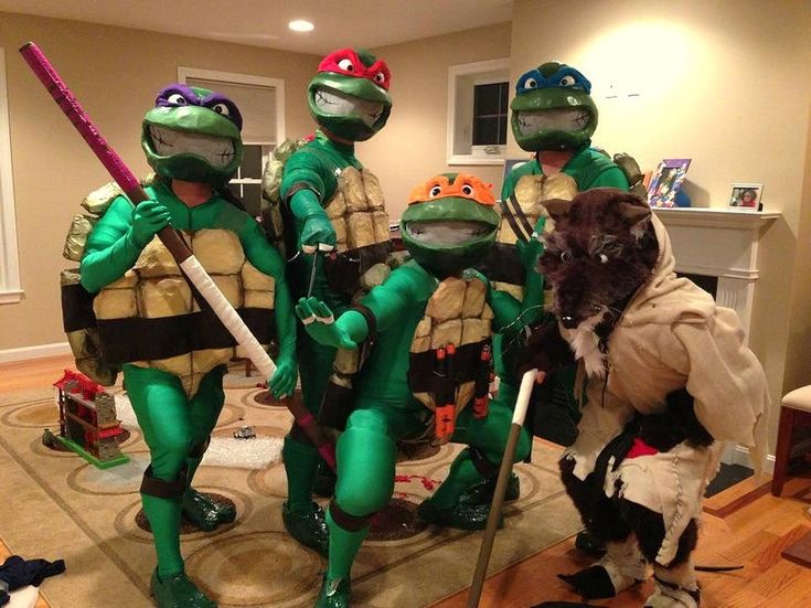 the teenage mutant turtles are dressed up in costumes and holding baseball bats while posing for a photo