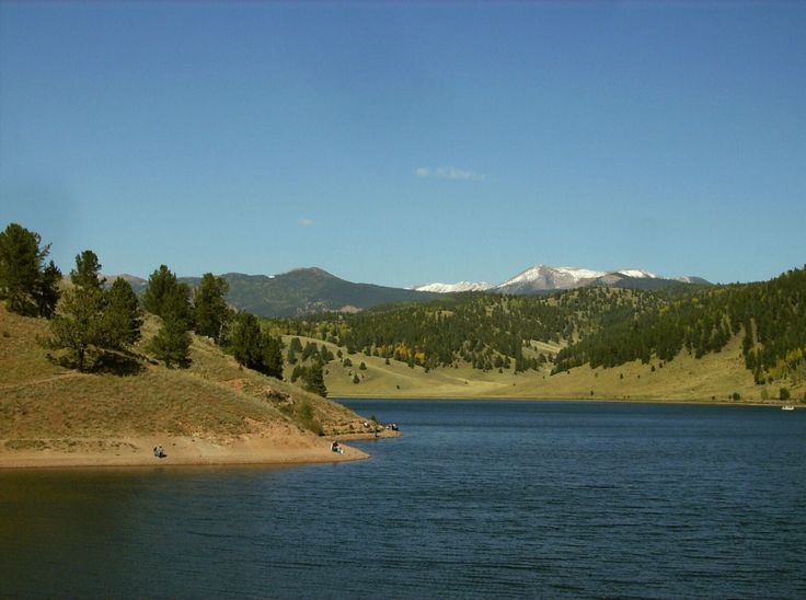 a lake with mountains in the background