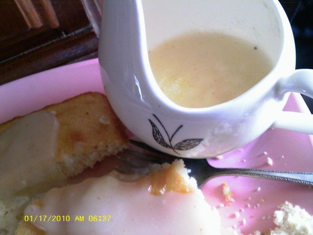 an egg is being served on toast with butter and gravy in a mug