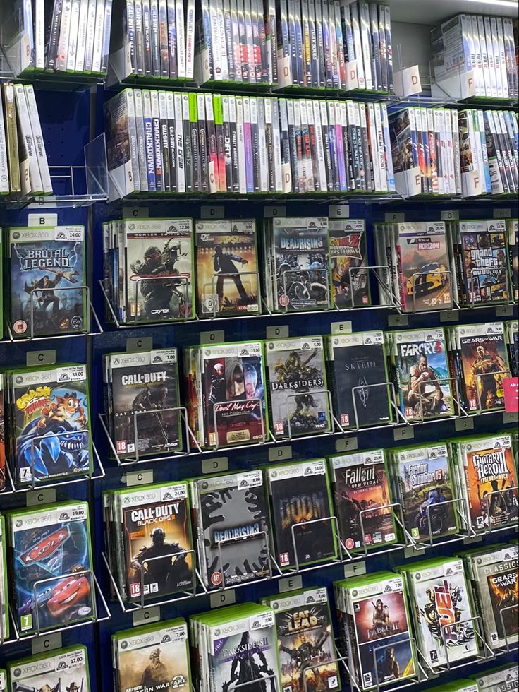 there are many video games on display in the store