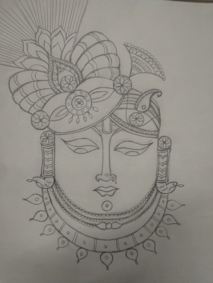 a drawing of a woman's face with an elaborate headdress on it