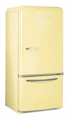 a yellow refrigerator freezer sitting on top of a white floor next to a wall