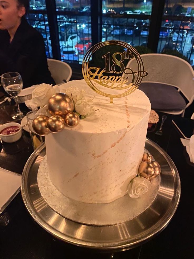 a white cake sitting on top of a table