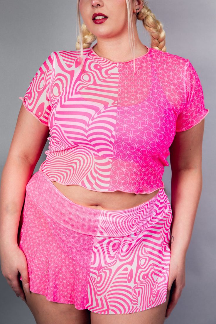 Shockingly stylish and perfect for partying! Our Electricity Mesh Baby Tee will keep you cool and looking electrifying as you dance the night away at any rave. With its unique mesh fabric, you'll never miss a beat. Power up your wardrobe with this must-have item! Product Details Duality but Neon Pink 🩷 UV Reactive FRW Exclusive! Mesh Crop Top for Extra Coverage Soft and Stretchy Handmade in San Diego, CA 90% Polyester 10% Spandex Satisfaction Guaranteed Lifetime Warranty *Rachel is wearing a size XLarge. Due to varying screen display settings, you may see some fabric images brighter or darker than the real fabric. So please consider that tolerance before ordering based on the website images. We won't be responsible for complaints regarding coloring. Rave Plus Size Outfits, T Shirt Rave Outfit, Mid Size Rave Outfits, Colorful Festival Outfit, Plus Size Rave Outfits, Simple Rave Outfits, Rave Festival Outfit Ideas, Rave Inspiration, Thrifting Clothes