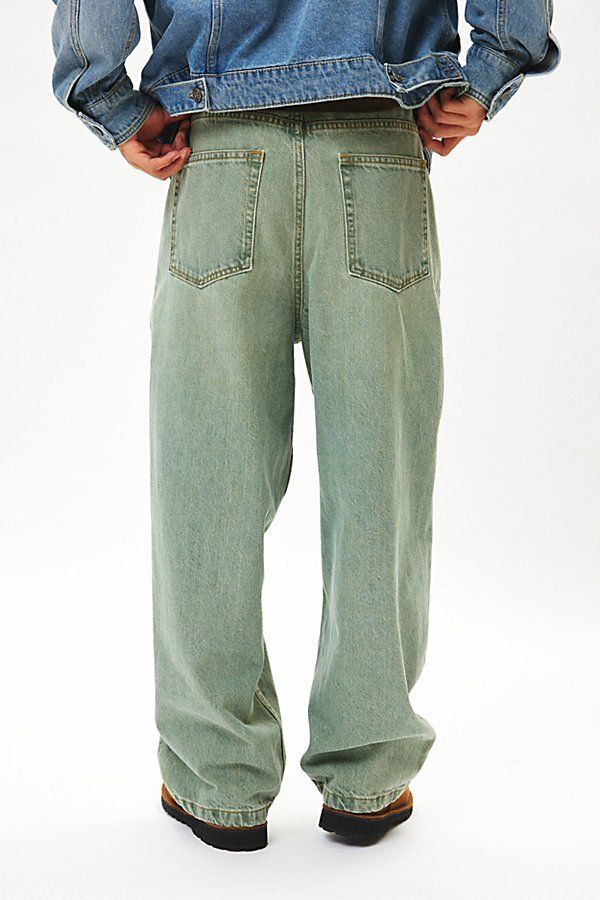 Oversized fit jeans from the essential BDG denim label. Extra relaxed silhouette with straight leg openings and a mid rise. Slouchy at the waist with a relaxed fit that puddles at the shoe. Classic 5-pocket denim styling with a button and zip fly closure. Fitted with an internal drawstring for an adjustable fit – size up for an ultra-baggy look. Urban Outfitters exclusive. Features BDG 2000s mega baggy jeans Baggy fit jeans Extra relaxed rise, hip & thigh 14oz. denim UO exclusive Content + Care Baggy Green Jeans For Streetwear, Urban Straight Jeans For Streetwear, Straight Cotton Bottoms For Streetwear, Green Denim Jeans For Streetwear, Rigid Denim Straight Pants For Streetwear, Green Baggy Straight Leg Cargo Jeans, Straight Rigid Denim Pants For Streetwear, Straight Pants For Spring Streetwear, Green Straight Leg Cargo Jeans With Five Pockets