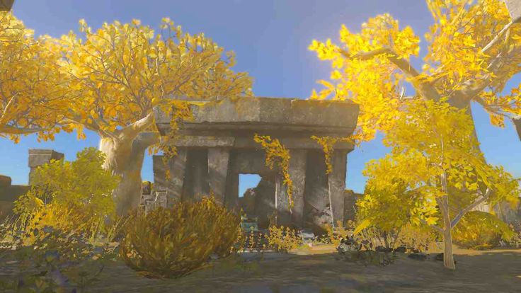 an image of some trees and rocks in the middle of a field with yellow leaves on them