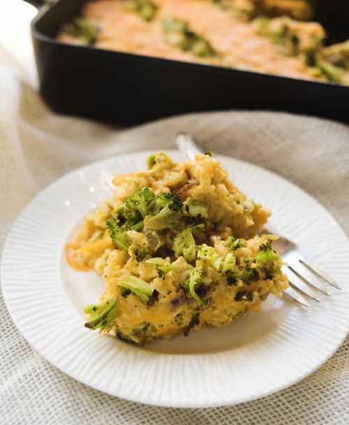 broccoli and rice casserole on a plate with a fork next to it