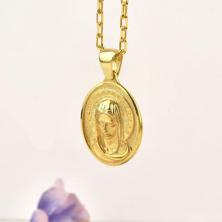 Holy Mother Virgin Mary necklace for Wife, 10k or 14K gold religious pendant necklace for mom, Catholic sterling silver necklace for her Our products are handmade and have a minimal design. All products are made of gold and silver, that is, precious and high-quality materials. Our products will complement your combinations for daily use or on special occasions and add elegance to you. You can also make your loved ones happy by gifting this beautiful product to them. As Therollerstone Team, we wi Spiritual Yellow Gold Necklaces, Mother's Day Gift Jewelry With Miraculous Medal, Miraculous Medal Jewelry Gift For Mother's Day, Miraculous Medal Necklace For Mother's Day Gift, 14k Gold Miraculous Medal As A Gift, Miraculous Medal Round Pendant Necklace For Gift, 14k Gold Miraculous Medal As Gift, Miraculous Medal Round Pendant Necklace As Gift, Oval Pendant Necklaces