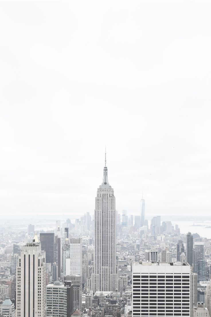 an aerial view of the empire building in new york city, with skyscrapers and other tall buildings