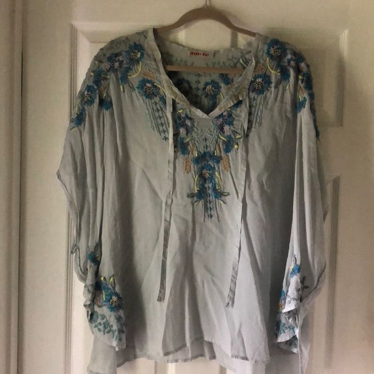 Beautiful Silk Embroidered Top. I Have Never Worn This. It Is A Dusky Blue Color And Absolutely Beautiful. Bohemian Light Blue Blouse With Floral Embroidery, Spring Embroidered Gray Tops, Blue Long Sleeve Embroidered Casual Top, Casual Blue Long Sleeve Embroidered Top, Embroidered Long Sleeve Light Blue Blouse, Blue Bohemian Embroidered Top, Casual Blue Embroidered V-neck Top, Light Blue Embroidered V-neck Top, Blue Casual Embroidered V-neck Top