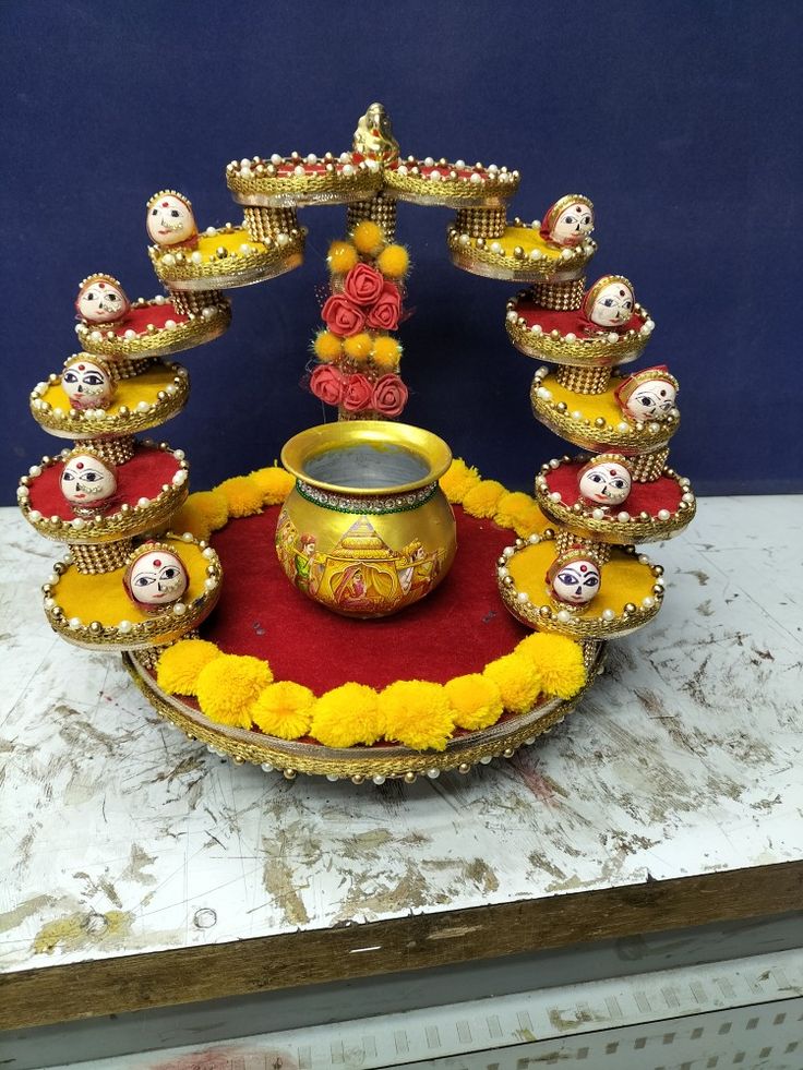 an elaborately decorated stand with pots and candles