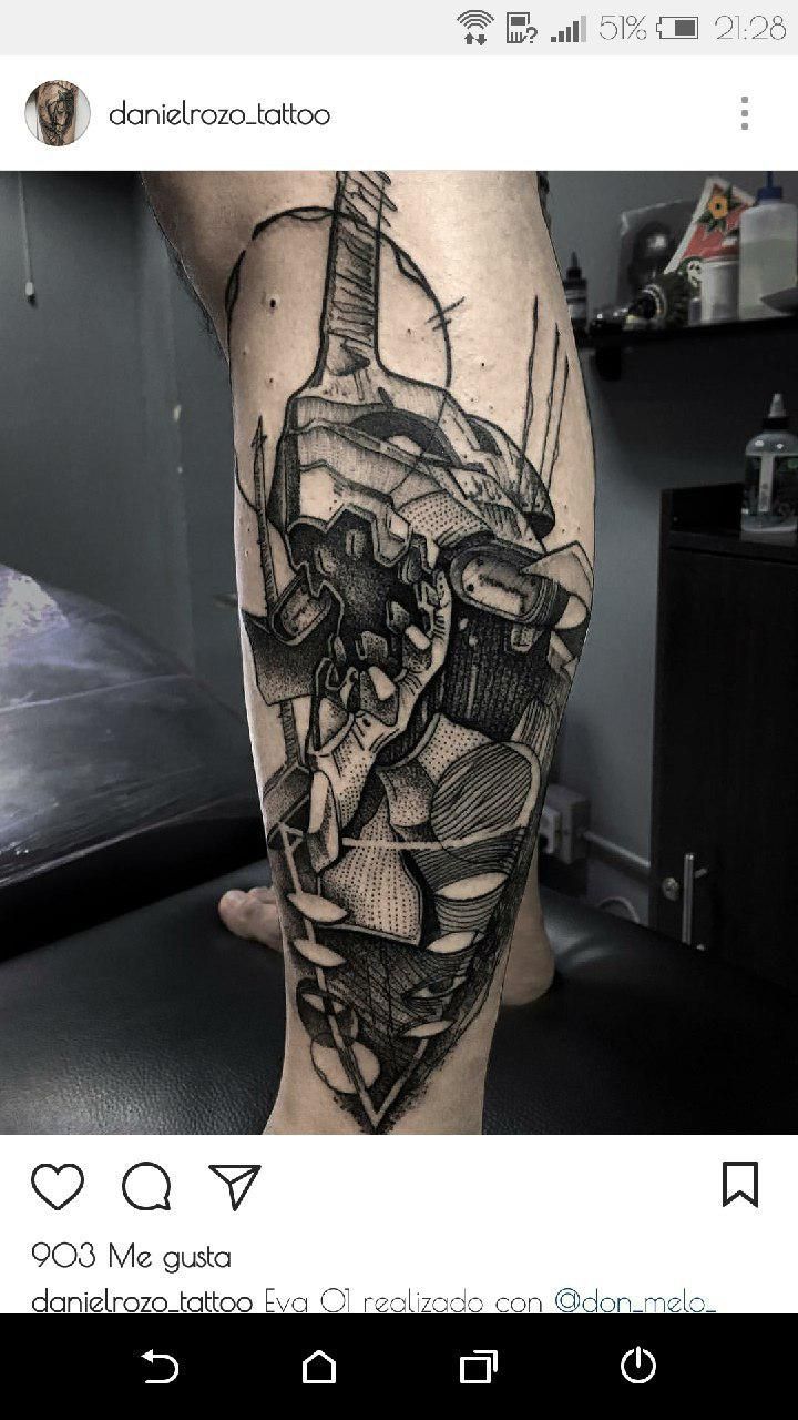 a man's leg with a black and white tattoo design on the side of his leg