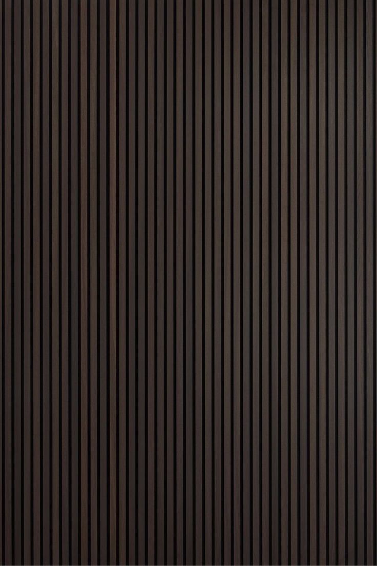 a brown wall with vertical lines on it