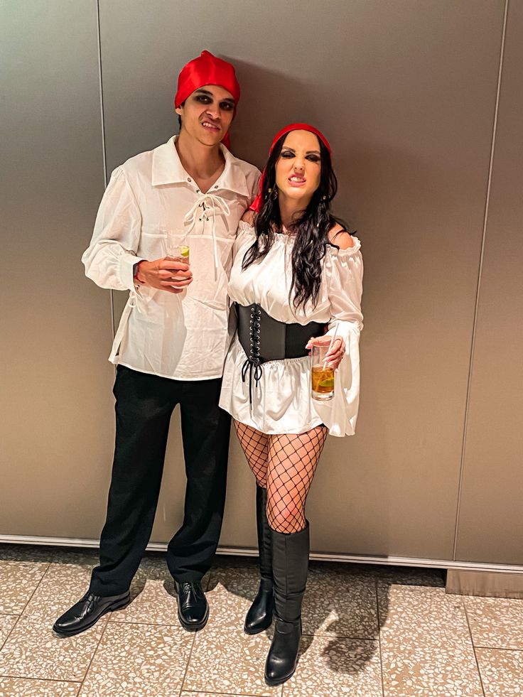 a man and woman dressed up in costumes