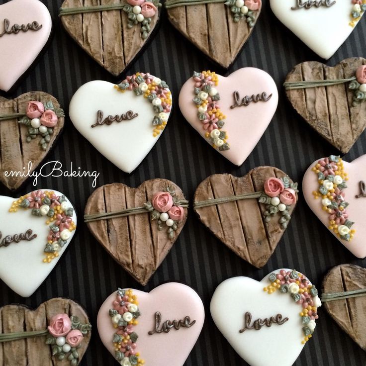 heart shaped cookies decorated with flowers and words