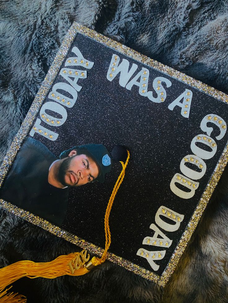 a graduation cap that has been decorated with an image of a man