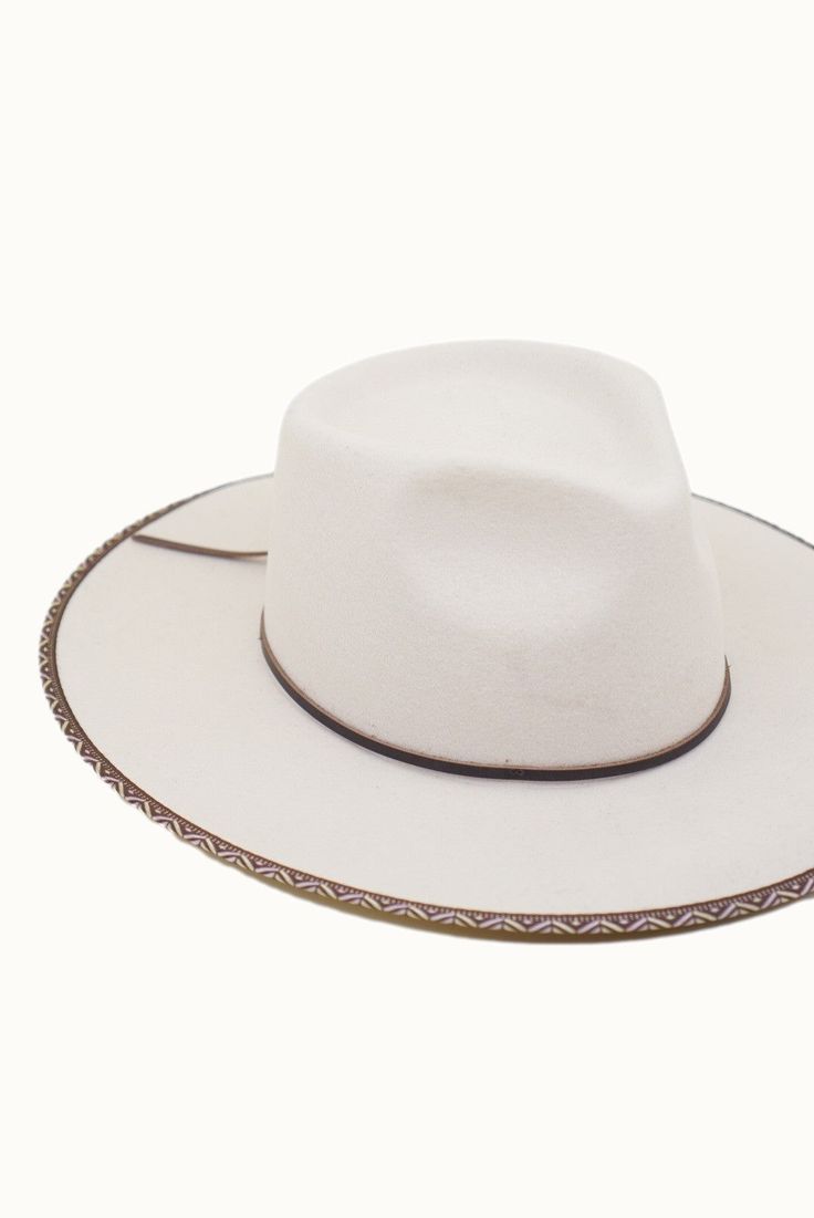 Look your best in the Avril White Rancher hat. It's crafted from quality wool felt for a classic look and feel that will last. The detailed trim and adjustable inner velcro strap ensure a comfortable fit. Show off your style with this timeless rancher! Adjustable Fur Felt Fedora Hats, Felt Hats For Rodeo In Fall, Flat Brim Felt Hat For Ranch, Cream Brimmed Felt Hat For Country Events, Adjustable Western Boater Hat In Fur Felt, Wool Boater Hat With Curved Brim, Adjustable Wool Boater Hat With Curved Brim, Adjustable Cream Felt Hat With Flat Crown, Cream Felt Hat With Short Brim For Rodeo