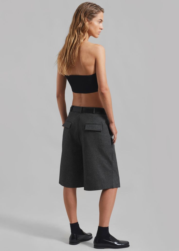 Color: Dark Grey Melange Lightweight traditional suiting fabric Oversized fit Pleated front detailing Long length Belt loops Side seam pockets Back flap pockets Hook and bar closure Zip fly Unlined 58% Polyester 36% Rayon 6% Polyurethane Dry Clean By The Frankie Shop. Imported Fitted Casual Culottes With Pockets, Casual Fitted Culottes With Pockets, Casual Bottoms With Welt Pockets For Tailoring, Casual Workwear Culottes With Pockets, Modern Bottoms With Short Inseam For Workwear, Wide-leg Shorts With Pockets For Work, Casual Fitted Culottes For Work, Elegant Short Pants With Pockets, Wide Leg Shorts With Pockets For Work