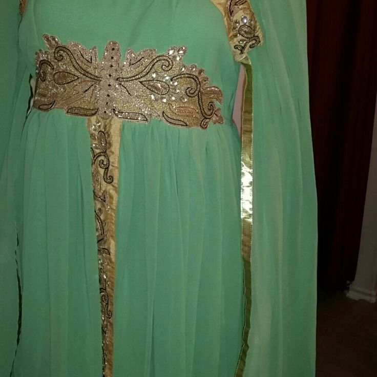 Hand Made Dubai Abaya Anarkali Long Sleeve Green Kaftan, Anarkali Green Long Sleeve Kaftan, Green Long Sleeve Thobe For Wedding, Green Wedding Thobe, Green Long Sleeve Abaya For Evening, Elegant Evening Green Abaya, Elegant Green Evening Abaya, Elegant Green Thobe With Dabka Detailing, Elegant Long Sleeve Green Thobe