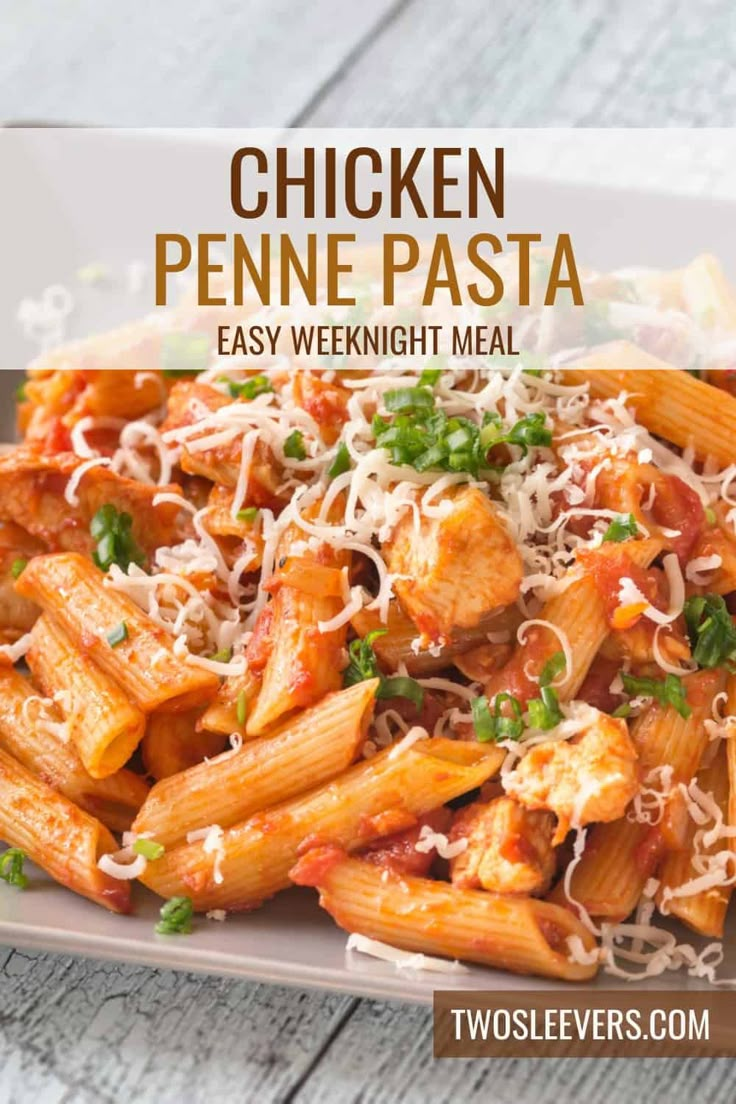 chicken penne pasta on a plate with parmesan cheese