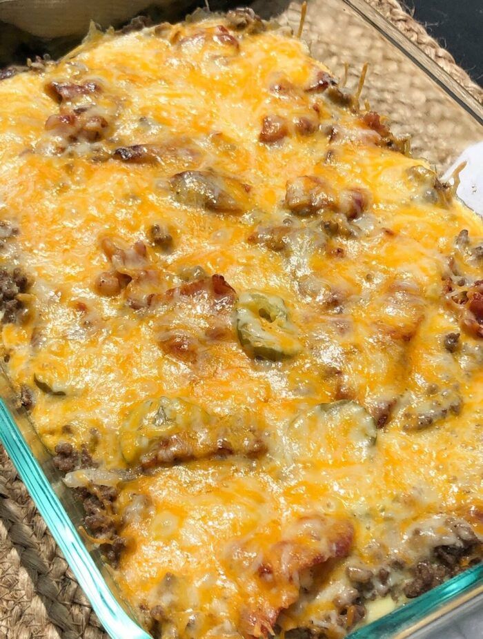 a casserole dish with meat and cheese in it