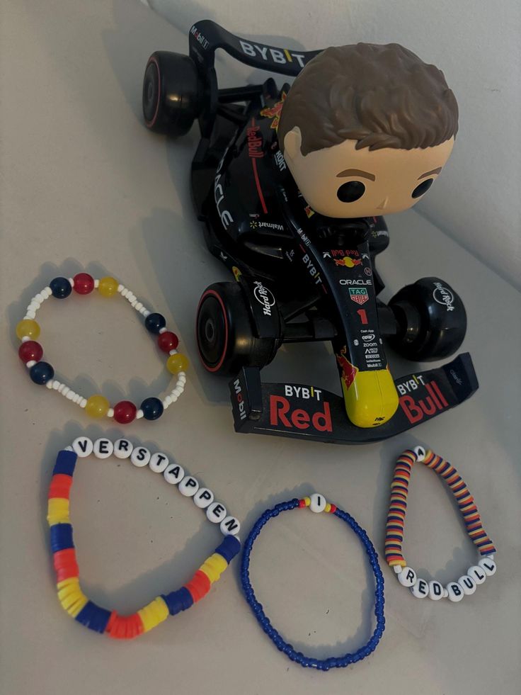 the toy is next to some bracelets and other items