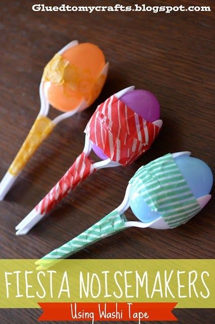 three candy lollipops sitting on top of a wooden table with text overlay