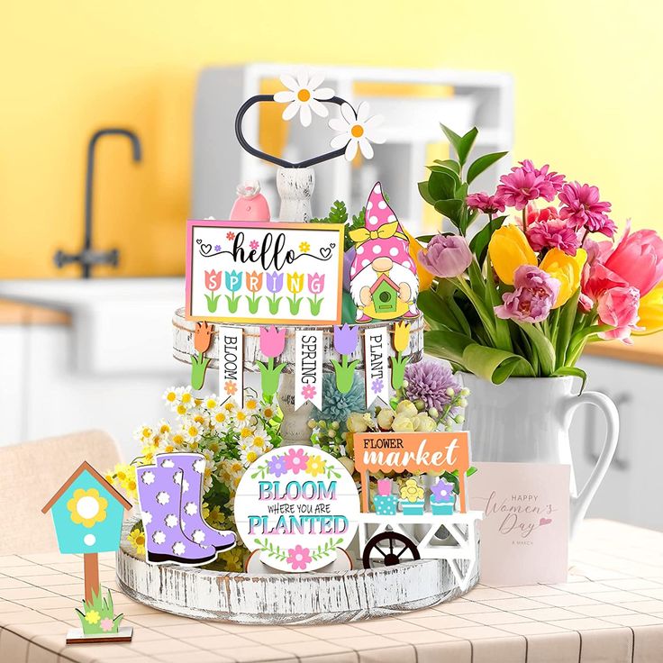 a table topped with lots of cards and flowers