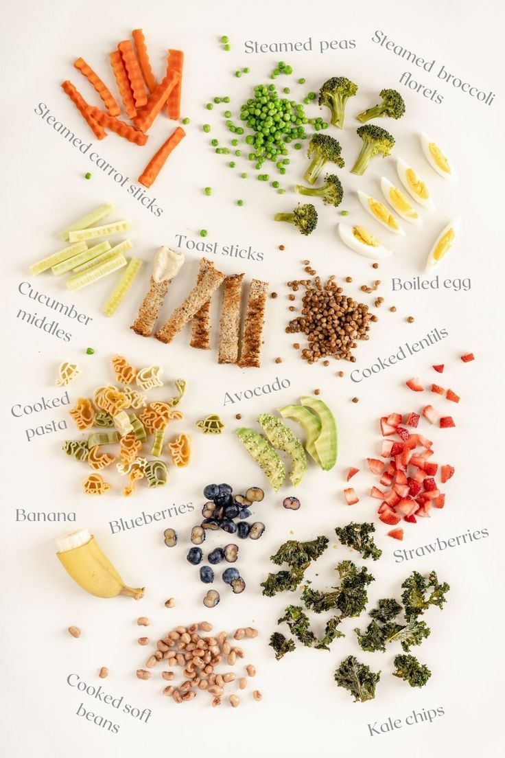 an array of vegetables and grains on a white surface