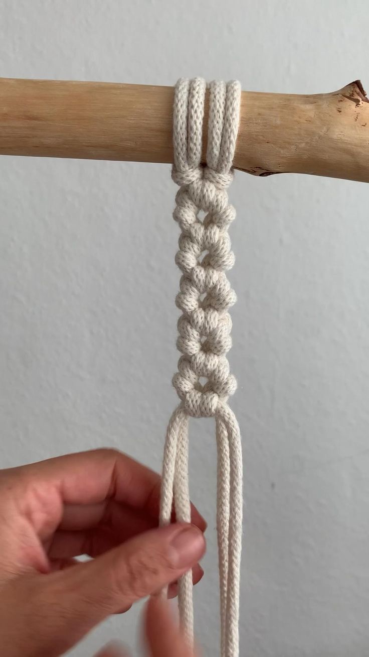 someone is holding the rope with their hands