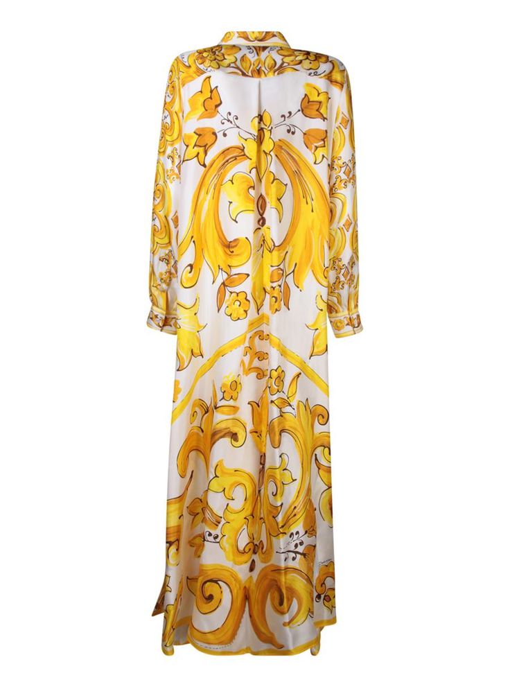 Long dress in light and breathable fabric with Maiolica print. Features frontal button closure and a classic collar.. This Dolce & Gabbana long dress captivates with its lively yellow and gold Maiolica print, offering an elegant cut that gently cascades down the body. Perfect for spectacular occasions or a sophisticated evening outGender: WomenMaterial: 100% SILKColor: YELLOWMade in: ImportedProduct ID: F6JDET HI1TK HG3TN*Import tax/duty will be calculated at checkout (If applicable) Elegant Silk Dress With Baroque Print, Yellow Silk Maxi Dress Floor-length, Yellow Silk Floor-length Maxi Dress, Luxury Baroque Print Dress, Elegant Yellow Printed Dress, Elegant Printed Maxi Dress For Daywear, Luxury Yellow Silk Dresses, Long Silk Dresses With Prints, Elegant Long Yellow Dresses