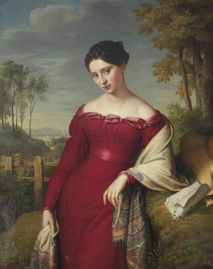 a woman in a red dress holding a white purse