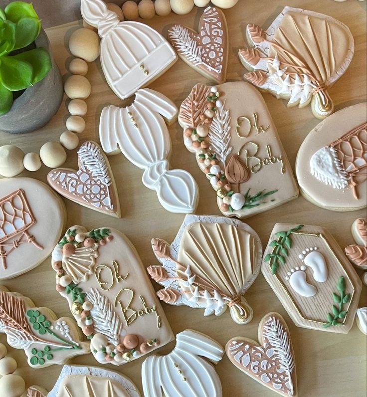 decorated cookies are arranged on a table