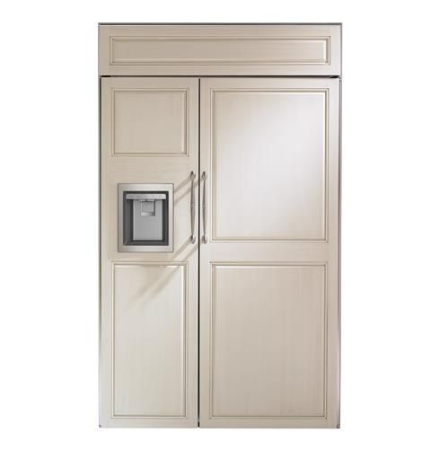 a white refrigerator freezer sitting inside of a wooden cabinet next to a metal door