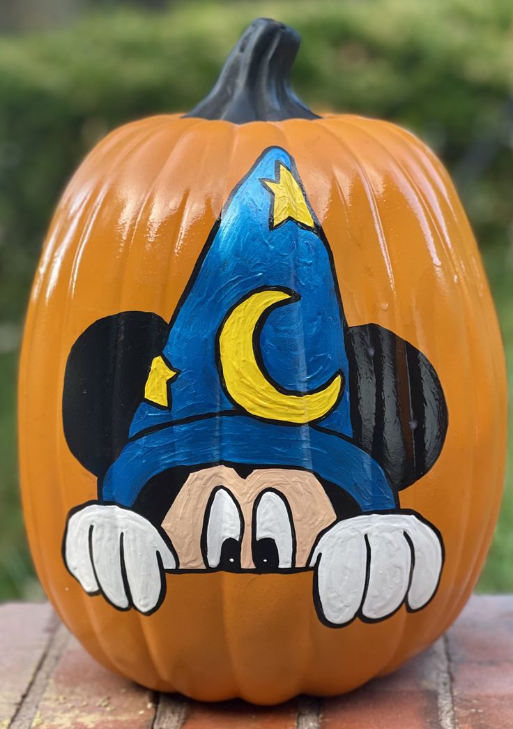 a mickey mouse pumpkin sitting on top of a table