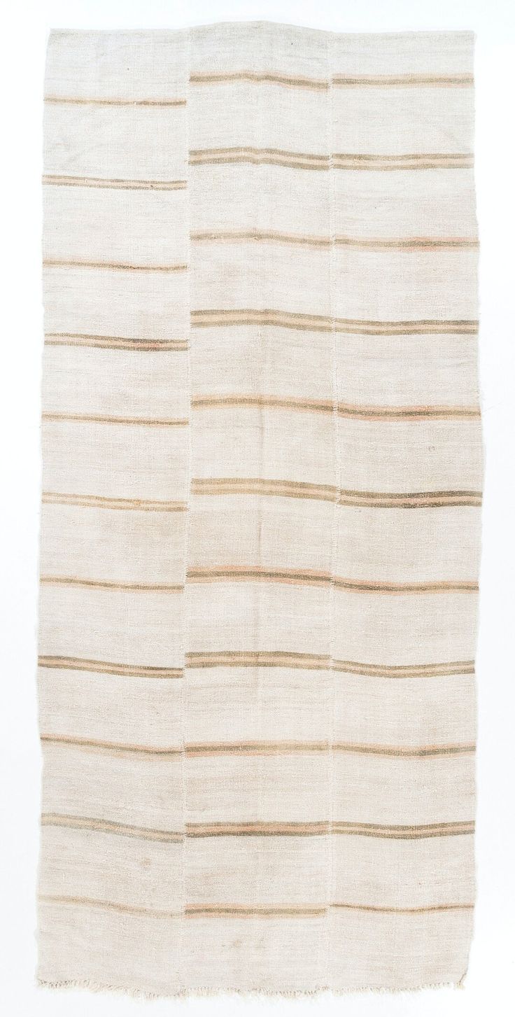 a white rug with brown stripes on the top and bottom, against a white background