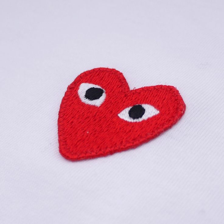 a red heart with two eyes on it