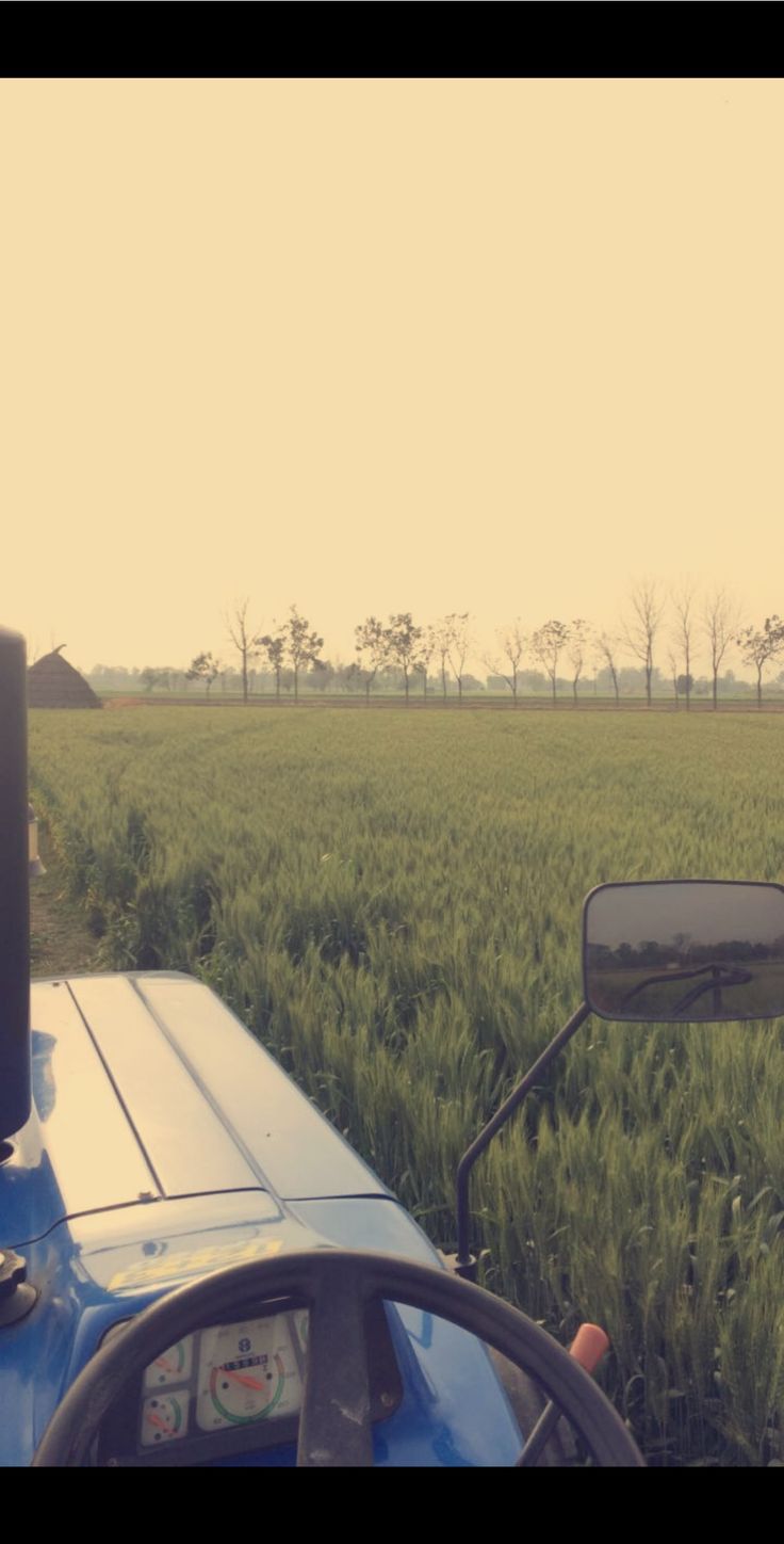 a tractor is parked in the middle of a field