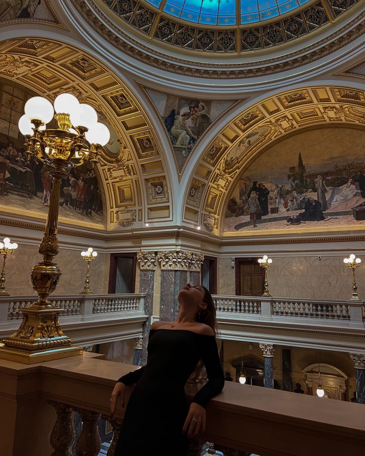 Girl wearing black dress standing in national museum of prague, her head is tilted back, she wears cherry red lipstick, she has long red nails and she’s wearing gold accessories Paris Trip Outfits, Prague Photography, Paris Instagram Pictures, Paris Photo Ideas, Prague Photos, Vienna Travel, Museum Photography, Budapest Travel, Prague Travel