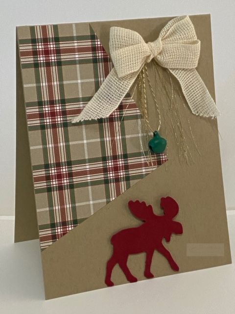 a close up of a card with a reindeer on it and a bow at the top