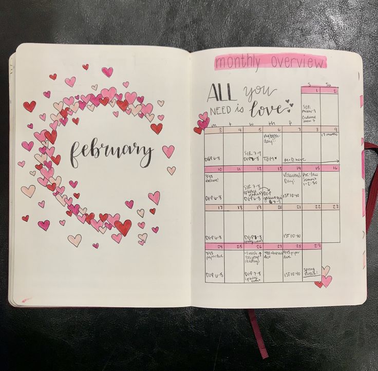 an open planner with hearts on it and the words february written in cursive writing