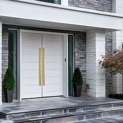 a white door and steps in front of a house