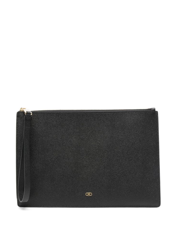 black calf leather grained texture rectangle shape wrist strap Gancini plaque to the front main compartment internal logo stamp gold-tone hardware top zip fastening Textured Leather Business Clutch, Formal Leather Pouch With Gold-tone Hardware, Elegant Business Bags With Logo Plaque, Luxury Textured Leather Business Clutch, Formal Textured Leather Pouch, Modern Business Clutch With Gold-tone Hardware, Business Clutch With Smooth Grain In Rectangular Shape, Classic Textured Leather Clutch For Daily Use, Classic Business Bag With Logo Plaque