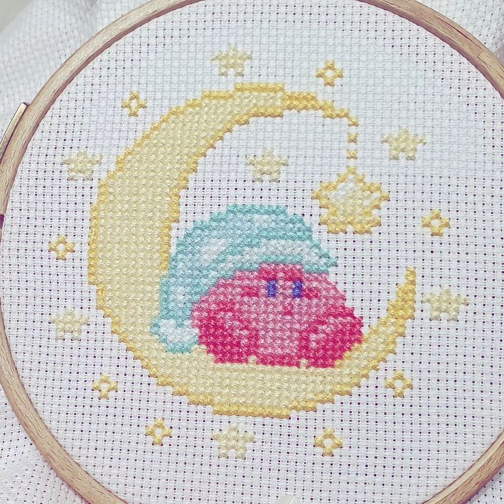 a cross stitch pattern with a pink pig on the moon and stars in the sky