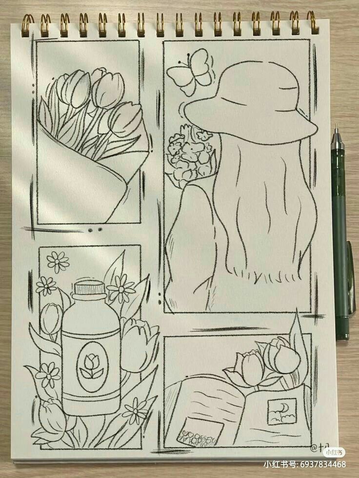 a notebook with drawings on it sitting on top of a table