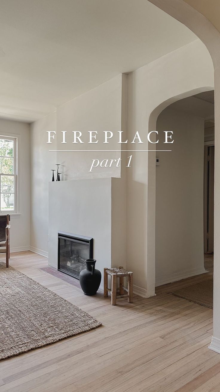 an empty living room with wood floors and white walls is featured in the fire place part 1