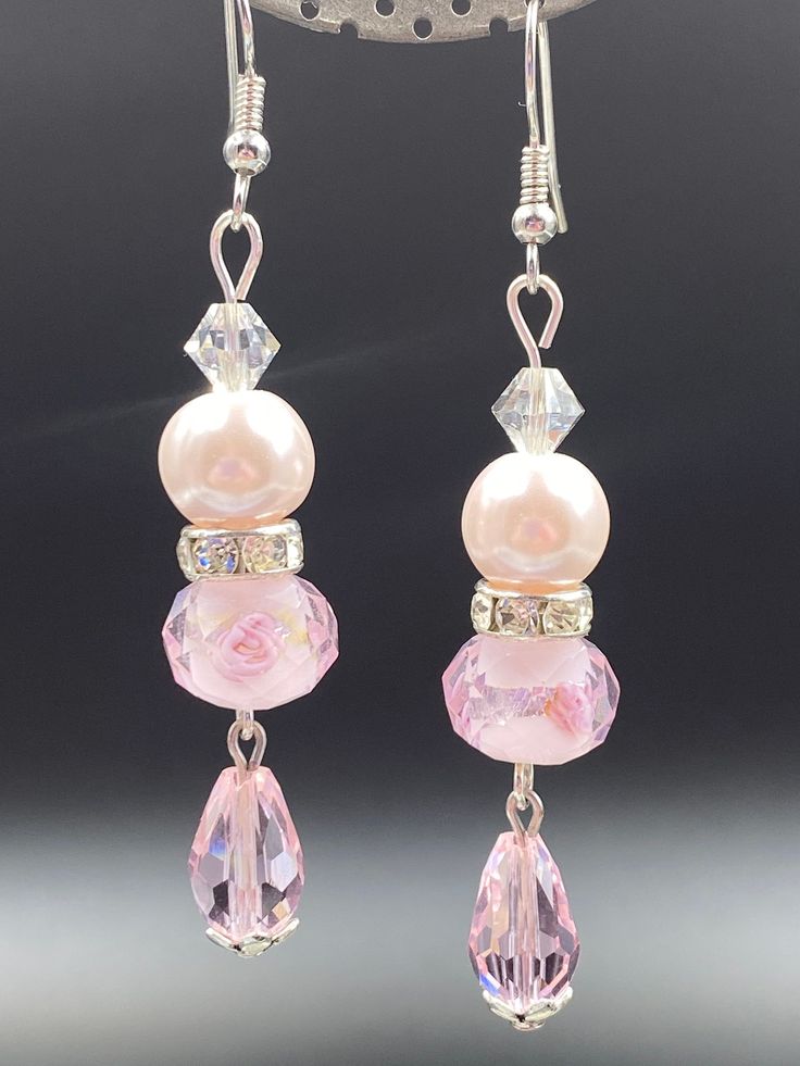 Pink glass & faux pearl beads with Swarovski Crystal rondelles accents. Elegant Pink Teardrop Beaded Earrings, Czech Glass Dangle Jewelry For Party, Pink Pearl Jewelry With Faceted Beads, Pearl Beaded Earrings With Dangling Beads For Party, Elegant Crystal Beaded Earrings With Round Beads, Czech Glass Crystal Dangle Earrings For Party, Czech Glass Crystal Dangle Earrings, Party Beaded Earrings With Faceted Czech Glass, Elegant Pink Czech Glass Earrings