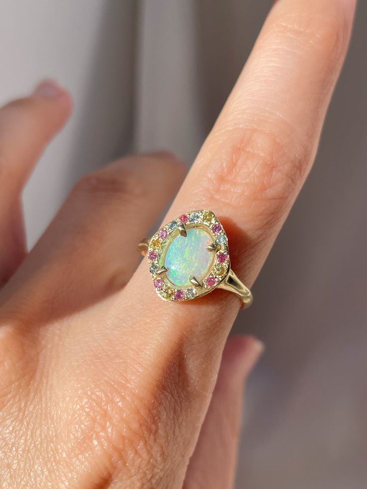 Cosmic Pastel Opal Solitaire Ring – Margaux Perrier Jewelry Multicolor Halo Jewelry For Wedding, Multicolor Halo Rings Fine Jewelry, Multicolor Oval Jewelry With Halo Setting, Multicolor Oval Halo Setting Jewelry, Oval Multicolor Jewelry With Halo Setting, Multicolor Jewelry With Halo Setting For Wedding, Multicolor Halo Setting Jewelry For Wedding, Multicolor Halo Setting Wedding Jewelry, Cluster Halo Ring As A Gift